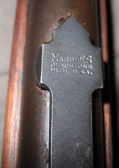 close-up overhead view of a Marble's rear rifle sight, showing it was manufactured in Gladstone, Mich., USA